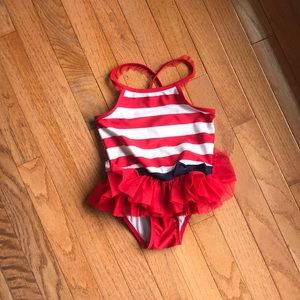Adorable girls red white and and blue swimsuit.
